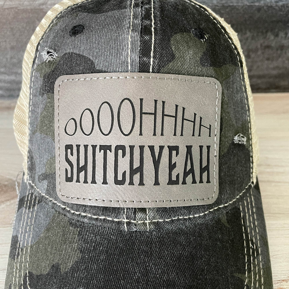 
                  
                    Distressed Camouflage Cap with Engraved Leather Patch
                  
                