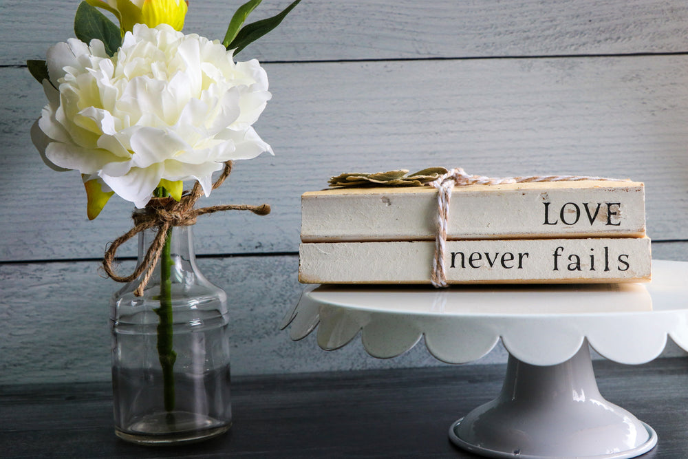 
                  
                    Love Never Fails Book Set | Painted Book Stack
                  
                