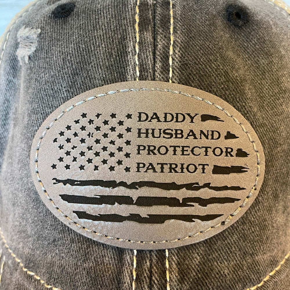 
                  
                    Daddy Husband Protector Patriot | Distressed Cap with Engraved Leather Patch
                  
                