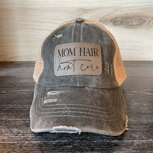 
                  
                    Mom Hair Don't Care | Women's Distressed Pony Cap with Engraved Leather Patch
                  
                
