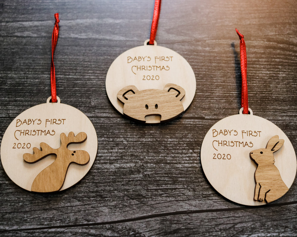 
                  
                    Baby's First Christmas | Engraved Wood Ornament with Laser Cut Animal
                  
                