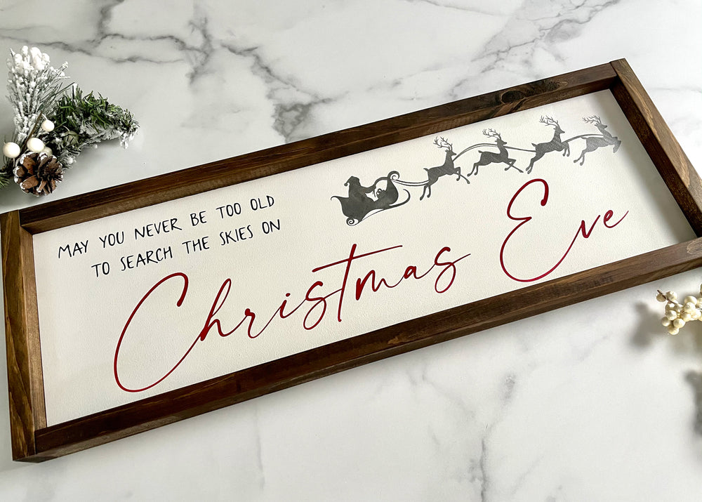 
                  
                    May You Never Be Too Old to Search the Skies on Christmas Eve | Framed Wood Sign | 24x9
                  
                