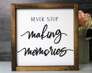 
                  
                    Never Stop Making Memories | Framed Laser Wood Sign
                  
                